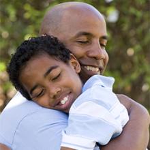 Father and son hugging